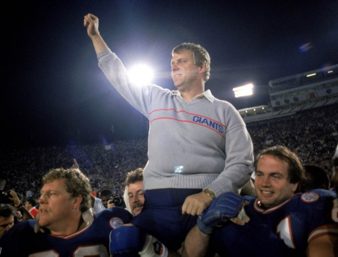 Chris Godfrey (bottom) right of head coach Bill Parcells. Chris Godfrey (bottom) right of head coach Bill Parcells.