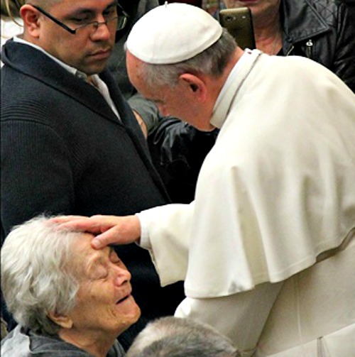 Pope Francis greets attendees at an audience last March.
Pope Francis greets attendees at an audience last March.
