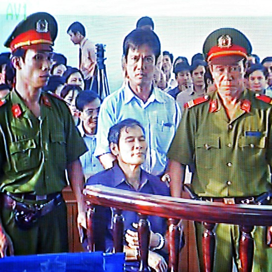 In this March 30, 2007 file image taken from a closed-circuit television, Father Nguyen Van Ly is seated in a courtroom in Hue, Vietnam. The country released the Catholic priest, who is one of its most prominent dissidents, prison in a move widely seen as a good will gesture before U.S. President Barack Obama visited. The Archdiocese of Hue reported on its webpage that it welcomed the return Friday of 70-year-old Father Ly from prison. He has been serving an eight-year prison term since March 2007 after being convicted of spreading propaganda against the state. In this March 30, 2007 file image taken from a closed-circuit television, Father Nguyen Van Ly is seated in a courtroom in Hue, Vietnam. The country released the Catholic priest, who is one of its most prominent dissidents, prison in a move widely seen as a good will gesture before U.S. President Barack Obama visited. The Archdiocese of Hue reported on its webpage that it welcomed the return Friday of 70-year-old Father Ly from prison. He has been serving an eight-year prison term since March 2007 after being convicted of spreading propaganda against the state.