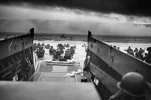 A landing craft from the U.S. Coast Guard-manned USS Samuel Chase disembarks troops of Company E, 16th Infantry, 1st Infantry Division (the Big Red One) wading onto Omaha Beach on the morning of June 6, 1944. During the initial landing two-thirds of Company E became casualties. A landing craft from the U.S. Coast Guard-manned USS Samuel Chase disembarks troops of Company E, 16th Infantry, 1st Infantry Division (the Big Red One) wading onto Omaha Beach on the morning of June 6, 1944. During the initial landing two-thirds of Company E became casualties.
