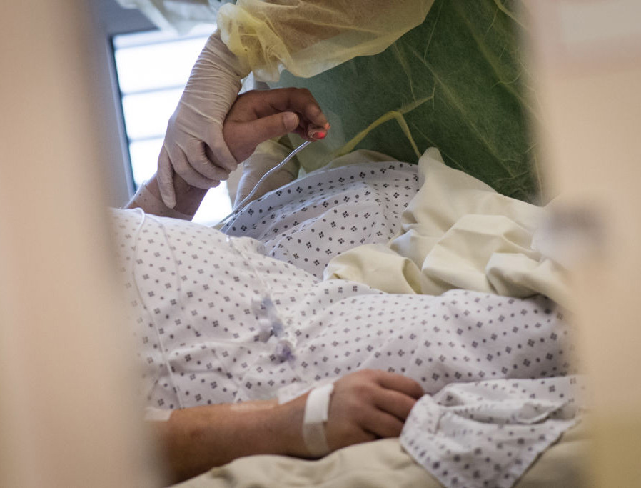 A nurse tends to a patient infected with the novel coronavirus, May 19, 2020. A nurse tends to a patient infected with the novel coronavirus, May 19, 2020.