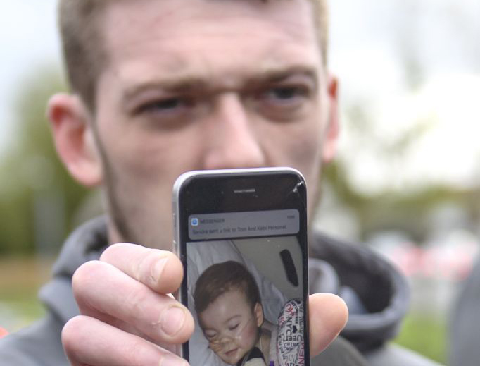 Tom Evans, Father of Alfie Evans, holds a photograph of his son as he speaks to media outside Alder Hey Children's Hospital on April 26, 2018 in Liverpool, England. Tom Evans, Father of Alfie Evans, holds a photograph of his son as he speaks to media outside Alder Hey Children's Hospital on April 26, 2018 in Liverpool, England.