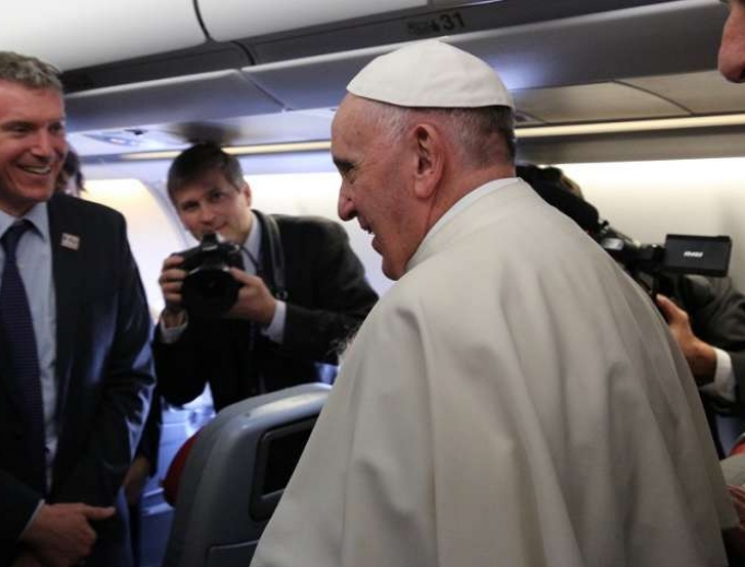Pope Francis and Matteo Bruni aboard the papal flight to Cuba Feb. 12, 2016. Pope Francis and Matteo Bruni aboard the papal flight to Cuba Feb. 12, 2016.