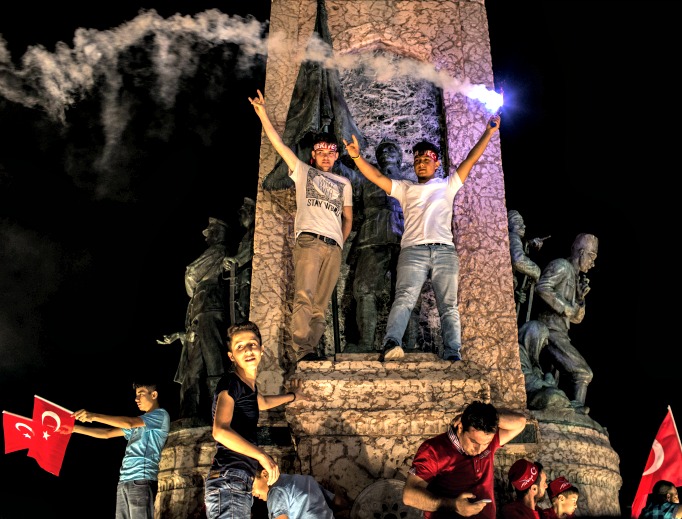 A man waves a flare from the Republic Monument in Taksim Square on July 20 in Istanbul, Turkey. Turkey's president Recep Erdogan enacted a three-month state of emergency following last nonth's failed coup. A man waves a flare from the Republic Monument in Taksim Square on July 20 in Istanbul, Turkey. Turkey's president Recep Erdogan enacted a three-month state of emergency following last nonth's failed coup.