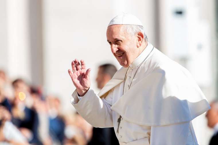 Pope Francis waves to the faithful in St. Peter's Square Sept. 26. Pope Francis waves to the faithful in St. Peter's Square Sept. 26.