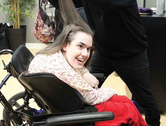 Bridget Burke receives a haircut at the Day Maker’s salon at the Misericordia home in Chicago. Bridget Burke receives a haircut at the Day Maker’s salon at the Misericordia home in Chicago.