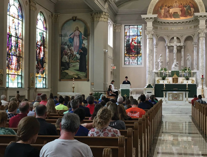 Above, students pray at Mass at St. John’s Catholic Newman Center at the University of Illinois. Below, students pray at ‘Magnify,’ an event that combines praise and worship music with Eucharistic adoration, at St. Mary’s Catholic Center at Texas A&M University. Above, students pray at Mass at St. John’s Catholic Newman Center at the University of Illinois. Below, students pray at ‘Magnify,’ an event that combines praise and worship music with Eucharistic adoration, at St. Mary’s Catholic Center at Texas A&M University.