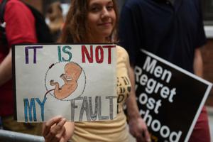 Pro-lifers hold signs in front of Planned Parenthood's Margaret Sanger Clinic on Bleecker Street in New York City on Aug. 22, 2015.
Pro-lifers hold signs in front of Planned Parenthood's Margaret Sanger Clinic on Bleecker Street in New York City on Aug. 22, 2015.