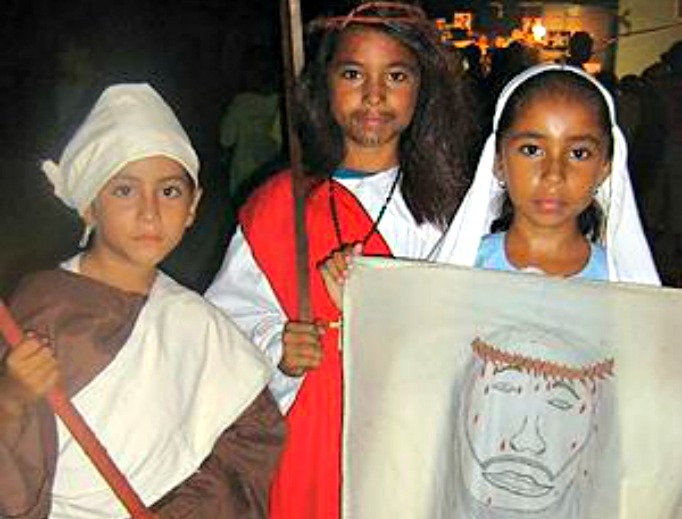 Three Belizean children dress as their favorite saints for Halloween. Three Belizean children dress as their favorite saints for Halloween.