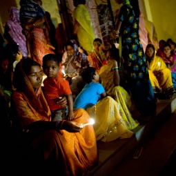 Families attend midnight Mass outside Our Lady Of Charity Church in Raikia, 200 miles south of Bhubaneswar, India.
Families attend midnight Mass outside Our Lady Of Charity Church in Raikia, 200 miles south of Bhubaneswar, India.
