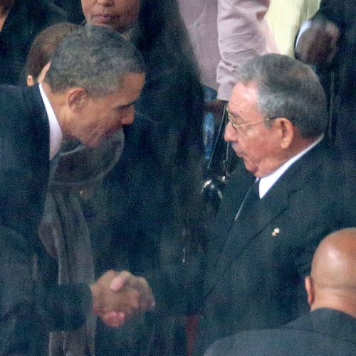 President Barack Obama greets Cuban President Raul Castro during the official memorial service for Nelson Mandela on Dec. 10, 2013, in Johannesburg, South Africa. President Barack Obama greets Cuban President Raul Castro during the official memorial service for Nelson Mandela on Dec. 10, 2013, in Johannesburg, South Africa.