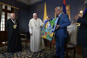 Pope Francis receives a gift from acting president of Mauritius Barlen Vyapoory Sept. 9. Pope Francis receives a gift from acting president of Mauritius Barlen Vyapoory Sept. 9.