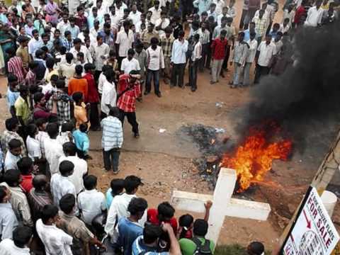A fire burns beside a cross during violence in the Kandhamal region of India during anti-Christian violence in 2008. A fire burns beside a cross during violence in the Kandhamal region of India during anti-Christian violence in 2008.