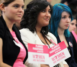 Women's rights activists listen during a Capitol Hill news conference July 11 that House Democratic leaders held to discuss the Republican-led repeal vote of the Affordable Care Act. Women's rights activists listen during a Capitol Hill news conference July 11 that House Democratic leaders held to discuss the Republican-led repeal vote of the Affordable Care Act.