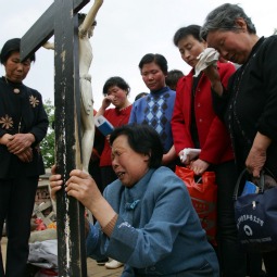 Catholics pray at the Cross Hill at Paowo Village in 2007 in Meixian County of Shaanxi Province, China. Cross Hill is a holy place first built by missionary Liu Jialu as a simulation of Calvary. Catholics pray at the Cross Hill at Paowo Village in 2007 in Meixian County of Shaanxi Province, China. Cross Hill is a holy place first built by missionary Liu Jialu as a simulation of Calvary.