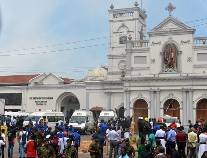 Ambulances are seen outside the church premises with gathered people and security personnel following a blast at the St. Anthony's Shrine in Kochchikade, Colombo on April 21, 2019. Ambulances are seen outside the church premises with gathered people and security personnel following a blast at the St. Anthony's Shrine in Kochchikade, Colombo on April 21, 2019.