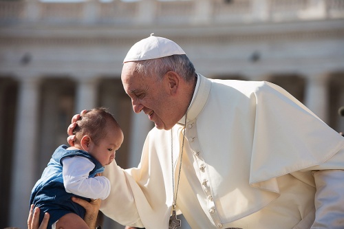The Pope greets a baby during his general audience on Aug. 26. The Pope greets a baby during his general audience on Aug. 26.