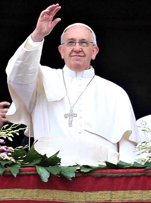 Pope Francis waves to the faithful as he delivers his message and blessing urbi et orbi from the central balcony of St. Peter's Basilica at the end of the Easter Mass. Pope Francis waves to the faithful as he delivers his message and blessing urbi et orbi from the central balcony of St. Peter's Basilica at the end of the Easter Mass.