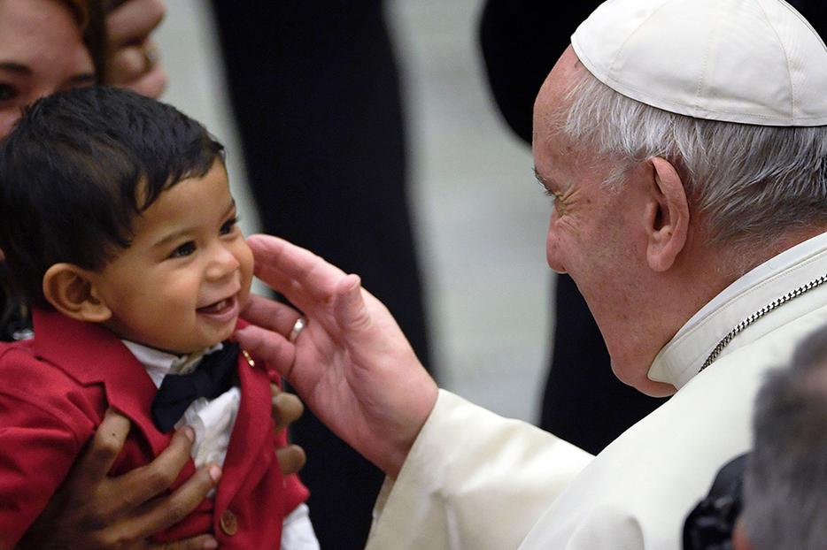 Pope Francis blesses a toddler at the weekly general audience Feb. 12 at the Paul VI Hall in the Vatican. Pope Francis blesses a toddler at the weekly general audience Feb. 12 at the Paul VI Hall in the Vatican.