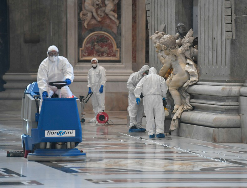 Workers sanitize St. Peter's Basilica May 15 in preparation for the resumption of public ceremonies. Workers sanitize St. Peter's Basilica May 15 in preparation for the resumption of public ceremonies.