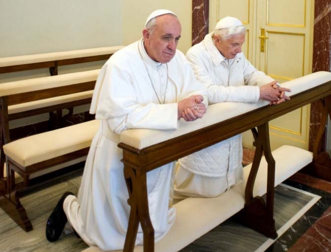 Pope Emeritus Benedict XVI praying with Pope Francis in the chapel at Castel Gandolfo. Pope Emeritus Benedict XVI praying with Pope Francis in the chapel at Castel Gandolfo.