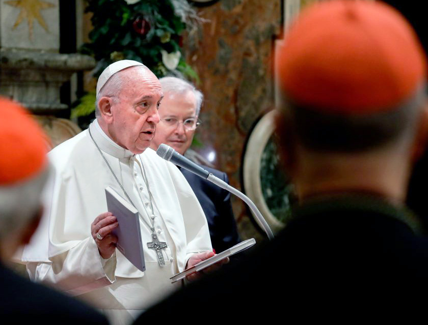 Pope Francis holds two books he presented as a gift to cardinals and bishops on the occasion of his Christmas greetings to the Roman Curia, Dec. 21, 2019, in the Clementine Hall at the Vatican. Pope Francis holds two books he presented as a gift to cardinals and bishops on the occasion of his Christmas greetings to the Roman Curia, Dec. 21, 2019, in the Clementine Hall at the Vatican.