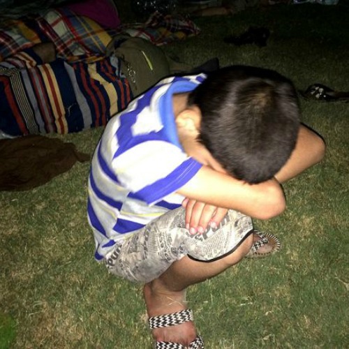 A young refugee rests after having fled from ISIS and arrived in Ankawa in the northern part of Erbil, Iraq. A young refugee rests after having fled from ISIS and arrived in Ankawa in the northern part of Erbil, Iraq.