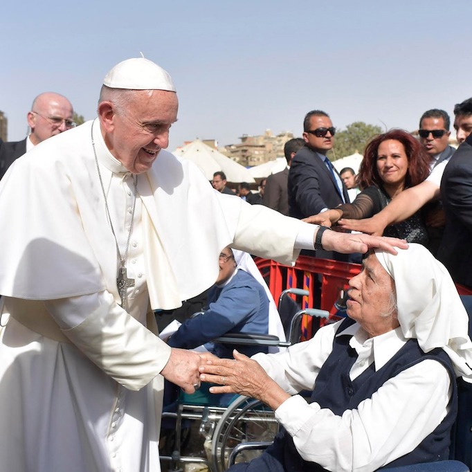 Pope Francis greets a religious sister April 29 in Cairo. Pope Francis greets a religious sister April 29 in Cairo.