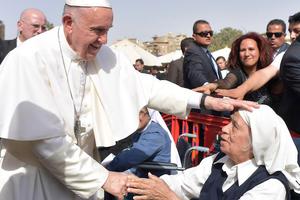 Pope Francis greets a religious sister April 29 in Cairo. Pope Francis greets a religious sister April 29 in Cairo.