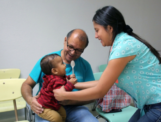 Volunteers at a Catholic Charities Center helping children in McAllen, Texas, 2017. Volunteers at a Catholic Charities Center helping children in McAllen, Texas, 2017.