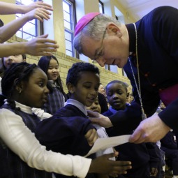Archbishop John Nienstedt with school children in the Archdiocese of St. Paul and Minneapolis. Archbishop John Nienstedt with school children in the Archdiocese of St. Paul and Minneapolis.