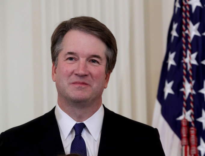 U.S. Circuit Judge Brett Kavanaugh looks on as U.S. President Donald Trump introduces him as his nominee to the U.S. Supreme Court during an event in the East Room of the White House July 9. Pending confirmation by the U.S. Senate, Judge Kavanaugh would succeed Associate Justice Anthony Kennedy, 81, who is retiring after 30 years of service on the high court.
U.S. Circuit Judge Brett Kavanaugh looks on as U.S. President Donald Trump introduces him as his nominee to the U.S. Supreme Court during an event in the East Room of the White House July 9. Pending confirmation by the U.S. Senate, Judge Kavanaugh would succeed Associate Justice Anthony Kennedy, 81, who is retiring after 30 years of service on the high court.