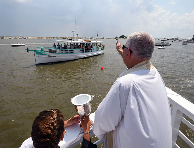 Fr. Greg Barras blesses a boat Fr. Greg Barras blesses a boat