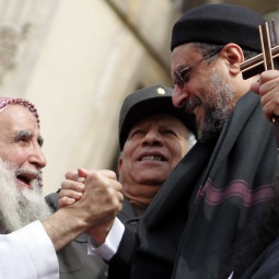 SEEKING PEACE. A Christian cleric clasps hands with a Muslim sheik during a rally to demonstrate unity between Muslims and Christians in Tahrir Square in Cairo, Egypt, March 11. The rally took place after recent sectarian clashes left 13 people dead. SEEKING PEACE. A Christian cleric clasps hands with a Muslim sheik during a rally to demonstrate unity between Muslims and Christians in Tahrir Square in Cairo, Egypt, March 11. The rally took place after recent sectarian clashes left 13 people dead.