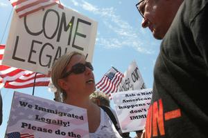 An opponent of allowing undocumented migrants to remain in the United States engages with a counter-protestor during a July 4 protest in Murrieta, Calif. Earlier, protesters turned away buses carrying about 140 immigrants who had been apprehended in Texas. An opponent of allowing undocumented migrants to remain in the United States engages with a counter-protestor during a July 4 protest in Murrieta, Calif. Earlier, protesters turned away buses carrying about 140 immigrants who had been apprehended in Texas.