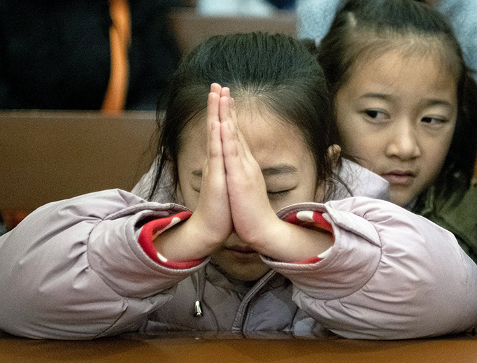 Children attend Christmas Eve Mass in Beijing on Dec. 24, 2019.
Children attend Christmas Eve Mass in Beijing on Dec. 24, 2019.