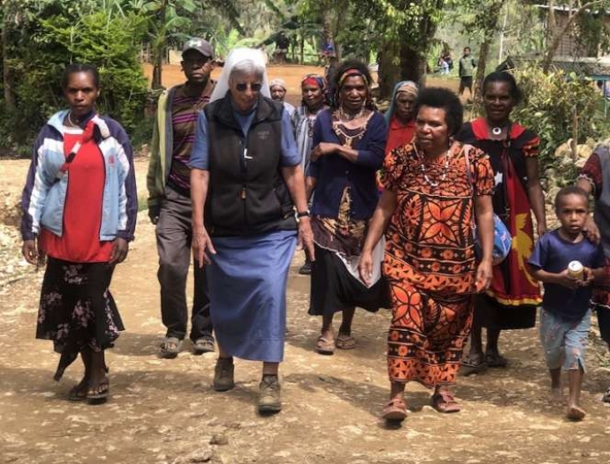 Sr. Lorena Jenal walks with local people from the Diocese of Mendi in Papua New Guinea. Sr. Lorena Jenal walks with local people from the Diocese of Mendi in Papua New Guinea.