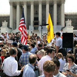 Opponents and proponents of President Obama’s health-care package await the Supreme Court’s ruling outside the U.S. Supreme Court building June 28 in Washington. Opponents and proponents of President Obama’s health-care package await the Supreme Court’s ruling outside the U.S. Supreme Court building June 28 in Washington.