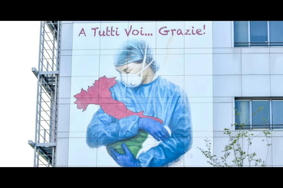 An image on the side of a building in Bergamo, Italy, March 22, 2020. An image on the side of a building in Bergamo, Italy, March 22, 2020.