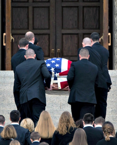 With family members following behind, pallbearers carry the casket of Supreme Court Justice Antonin Scalia through the Holy Door for the Year of Mercy of the Basilica of the National Shrine of the Immaculate Conception on Feb. 20 in Washington. With family members following behind, pallbearers carry the casket of Supreme Court Justice Antonin Scalia through the Holy Door for the Year of Mercy of the Basilica of the National Shrine of the Immaculate Conception on Feb. 20 in Washington.