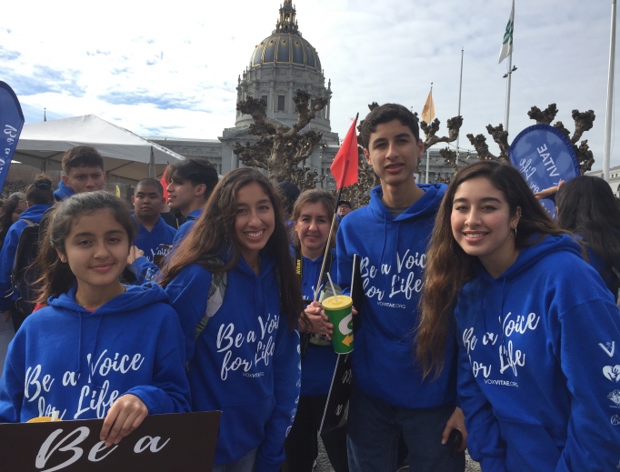 Above, teens attend the Walk for Life West Coast 2020 with Vox Vitae; below, Father Frank Pavone of Priests for Life and students from St. Joseph Academy pose for a photo in front of the San Francisco cathedral. Also below: Liz from Our Lady of Peace parish, along with her family, attends the walk, and seminarians from St. Patrick’s Seminary show their support for life. Bottom of page: Yoselin Donas, r, and her family attend the 16th-annual pro-life event. Above, teens attend the Walk for Life West Coast 2020 with Vox Vitae; below, Father Frank Pavone of Priests for Life and students from St. Joseph Academy pose for a photo in front of the San Francisco cathedral. Also below: Liz from Our Lady of Peace parish, along with her family, attends the walk, and seminarians from St. Patrick’s Seminary show their support for life. Bottom of page: Yoselin Donas, r, and her family attend the 16th-annual pro-life event.