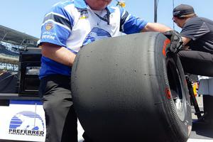 Above, Father Glenn O'Connor cleans a tire following a pit stop during practice for Josef Newgarden at the Indianapolis Motor Speedway. Below, Father O'Connor carries tires for the next session for Indianapolis 500 driver Newgarden. The priest will be working in his pits during Sunday's running of the 100th Indianapolis 500. Above, Father Glenn O'Connor cleans a tire following a pit stop during practice for Josef Newgarden at the Indianapolis Motor Speedway. Below, Father O'Connor carries tires for the next session for Indianapolis 500 driver Newgarden. The priest will be working in his pits during Sunday's running of the 100th Indianapolis 500.