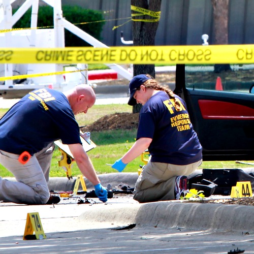 Investigators work a crime scene outside of the Curtis Culwell Center after a shooting occurred the day before May 4 in Garland, Texas. Investigators work a crime scene outside of the Curtis Culwell Center after a shooting occurred the day before May 4 in Garland, Texas.