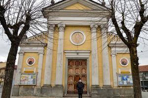 Don Carlo Chiomento, of the Church of St. John the Baptist in the Candiolo municipality of Turin, Italy, wears a mask as he stands outside his closed church. Don Carlo Chiomento, of the Church of St. John the Baptist in the Candiolo municipality of Turin, Italy, wears a mask as he stands outside his closed church.