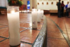 Candles honoring the 20 deceased victims of the El Paso mass shooting sit in St. Pius X Church Aug. 3 following a vigil for victims in El Paso, Texas. At least 26 people were wounded. Candles honoring the 20 deceased victims of the El Paso mass shooting sit in St. Pius X Church Aug. 3 following a vigil for victims in El Paso, Texas. At least 26 people were wounded.