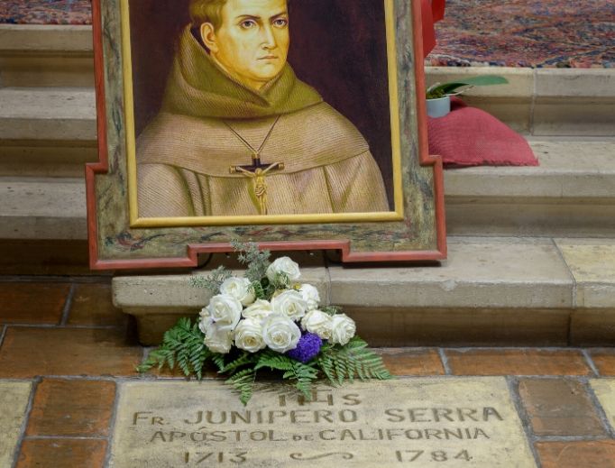 The grave of St. Junípero Serra, ‘Apostle of California,’ is located near the altar of the Carmel Mission in Carmel-by-the-Sea, California. The grave of St. Junípero Serra, ‘Apostle of California,’ is located near the altar of the Carmel Mission in Carmel-by-the-Sea, California.