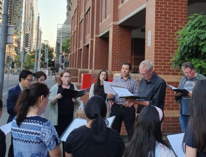 Carolers gather outside Melbourne Assessment Prison on Christmas Eve, 2019. Carolers gather outside Melbourne Assessment Prison on Christmas Eve, 2019.