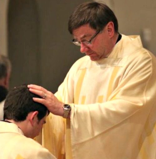 Father James Powers, who was appointed bishop of Superior on Dec. 15, blesses a newly ordained priest. Father James Powers, who was appointed bishop of Superior on Dec. 15, blesses a newly ordained priest.