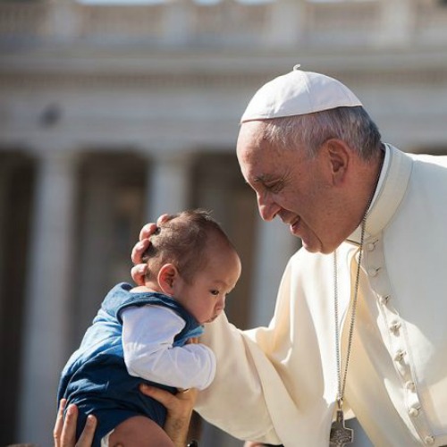 Pope Francis embraces a baby during the general audience in St. Peter's Square on Aug. 26. Pope Francis embraces a baby during the general audience in St. Peter's Square on Aug. 26.