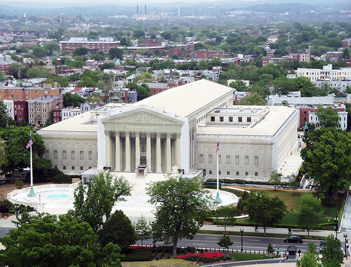 The Supreme Court Building of the United States from the dome of the capitol building. The facade is covered during renovation. The Supreme Court Building of the United States from the dome of the capitol building. The facade is covered during renovation.